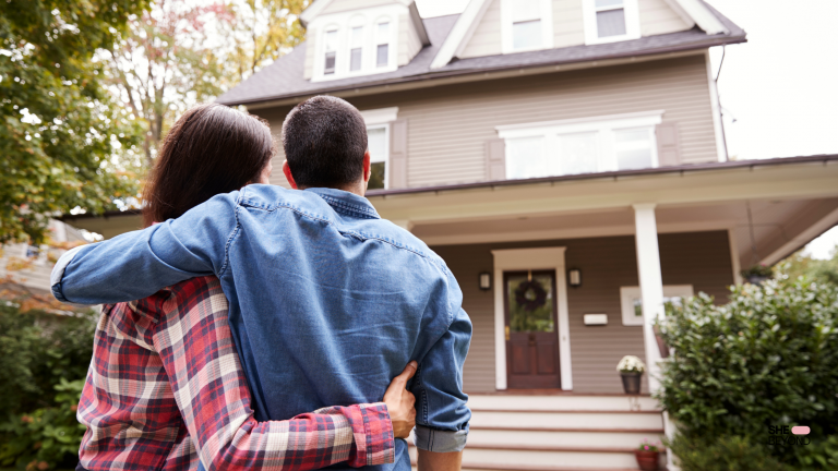 Expat woman standing in front of a new home for expat housing U.S.