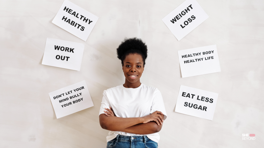 Woman standing before signs explaining U.S. healthcare for women living abroad.