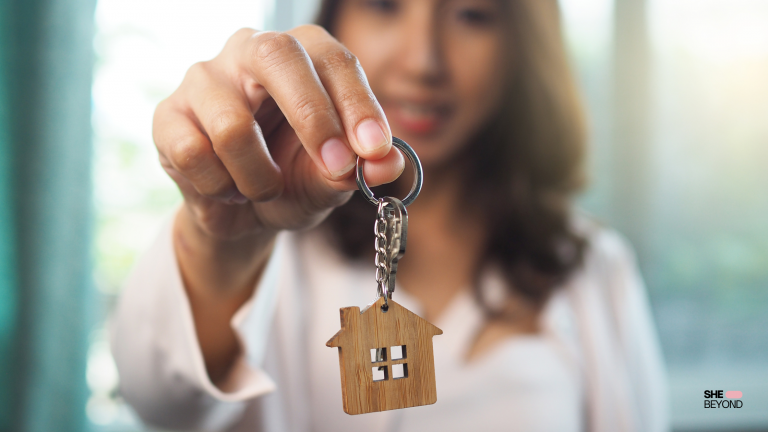 Expat housing U.S. woman holding key to new home